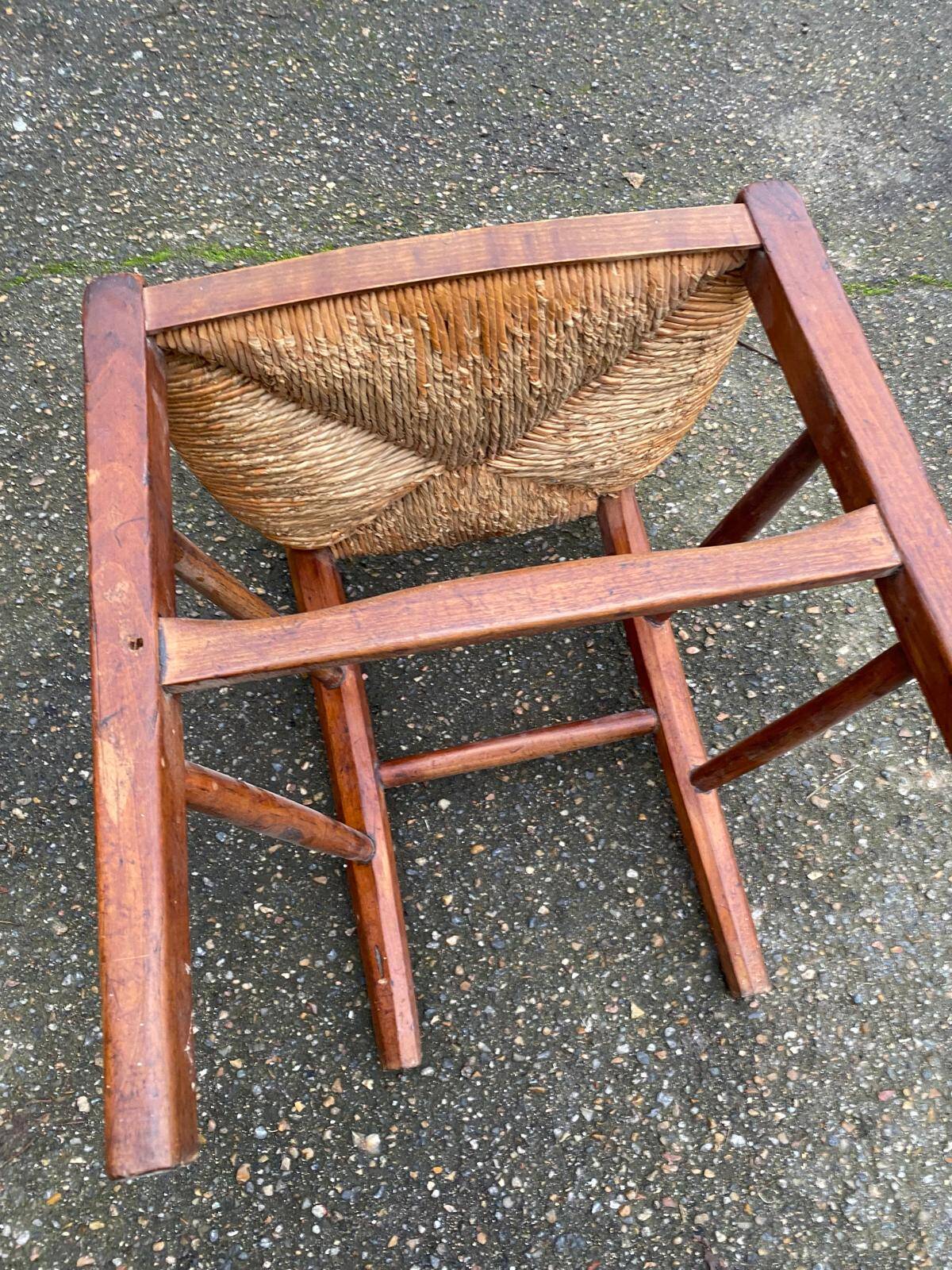 2 solid wood chairs with rush seats, child size.