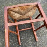 2 solid wood chairs with rush seats, child size.