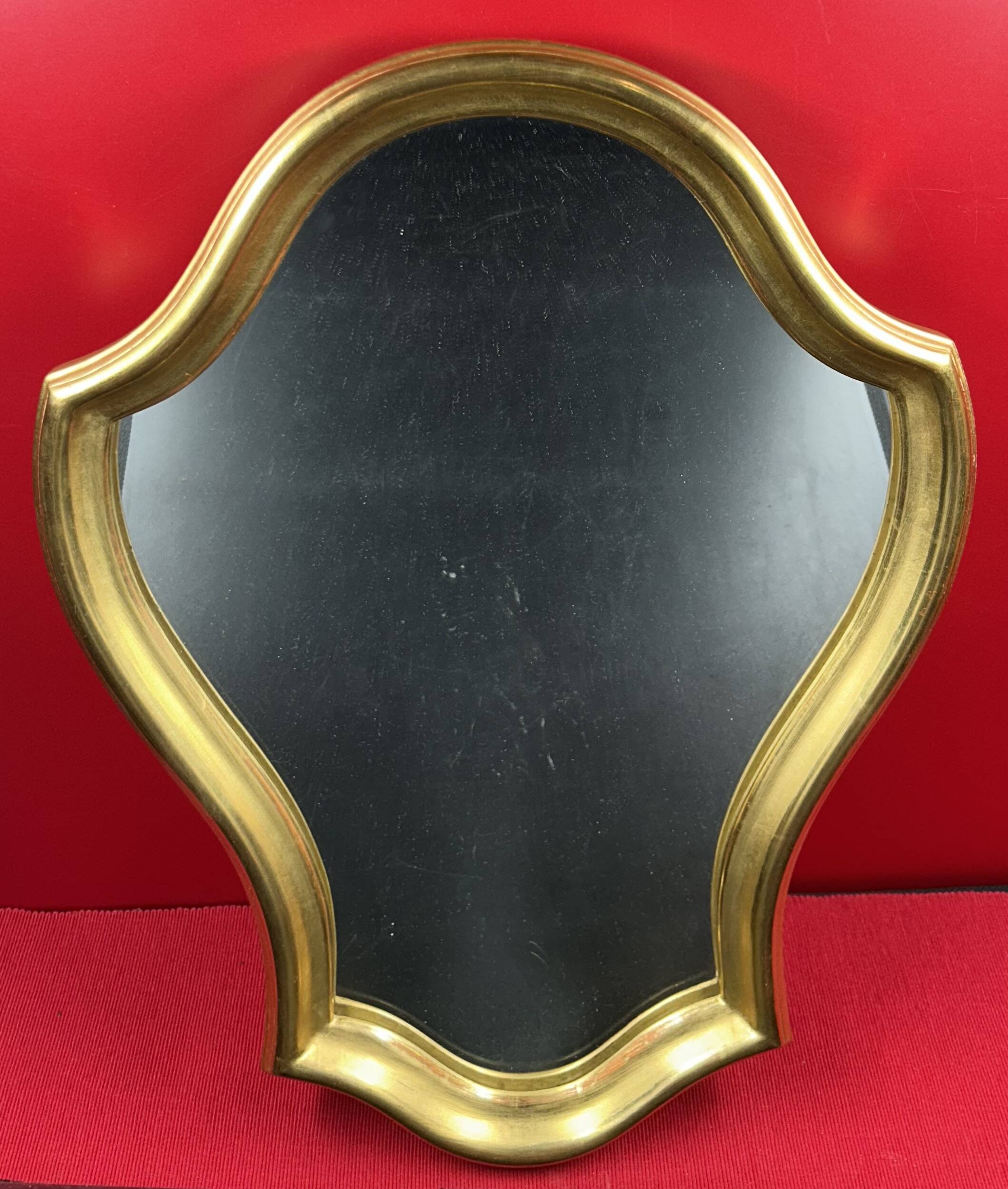 Mirror with a wavy shape, wood and gilded stucco
