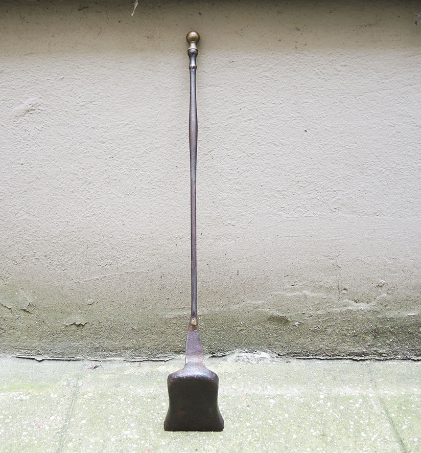 Old chimney shovel in wrought iron and brass