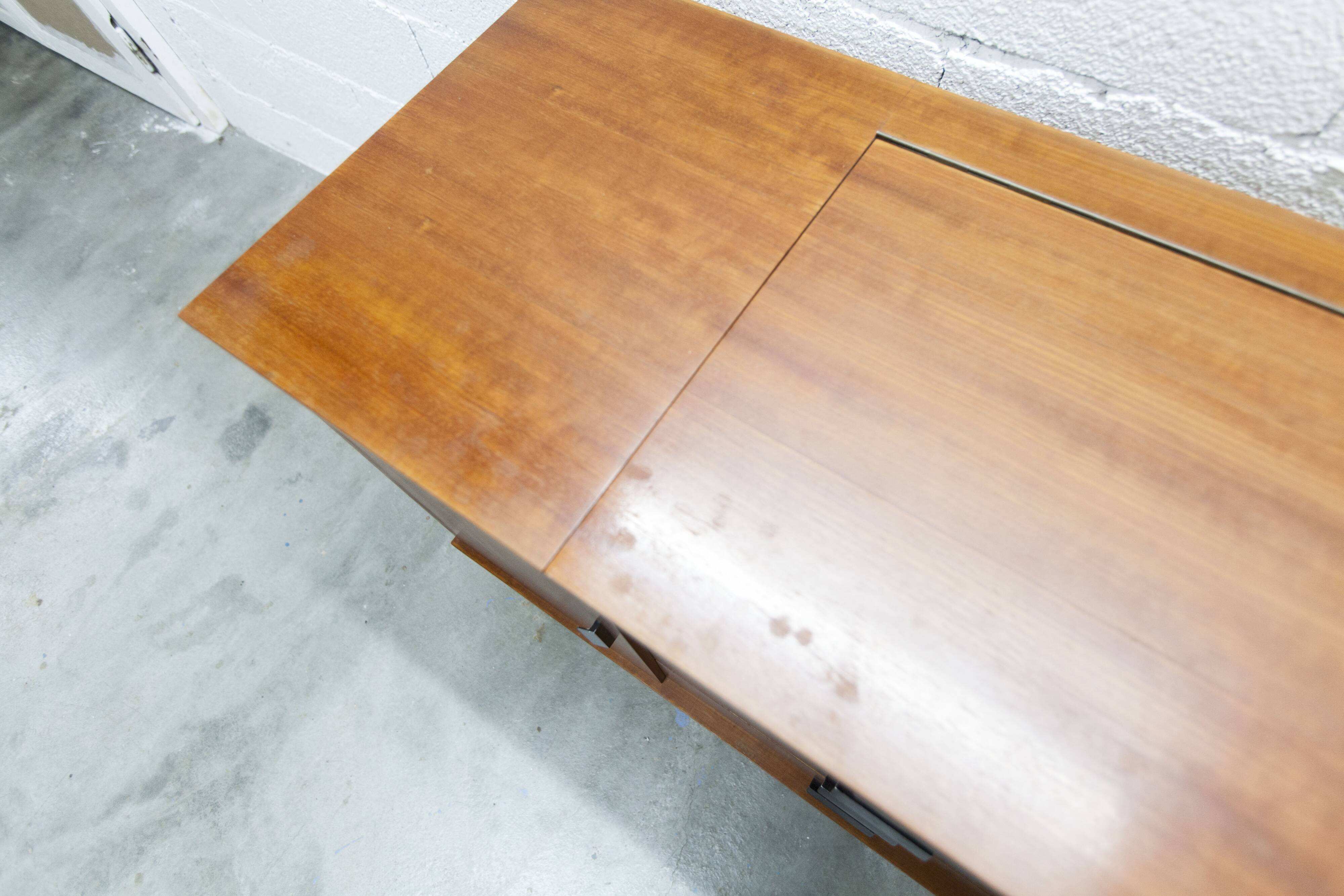 1960s teak sideboard with 4 drawers, 2 doors, and a mirror.