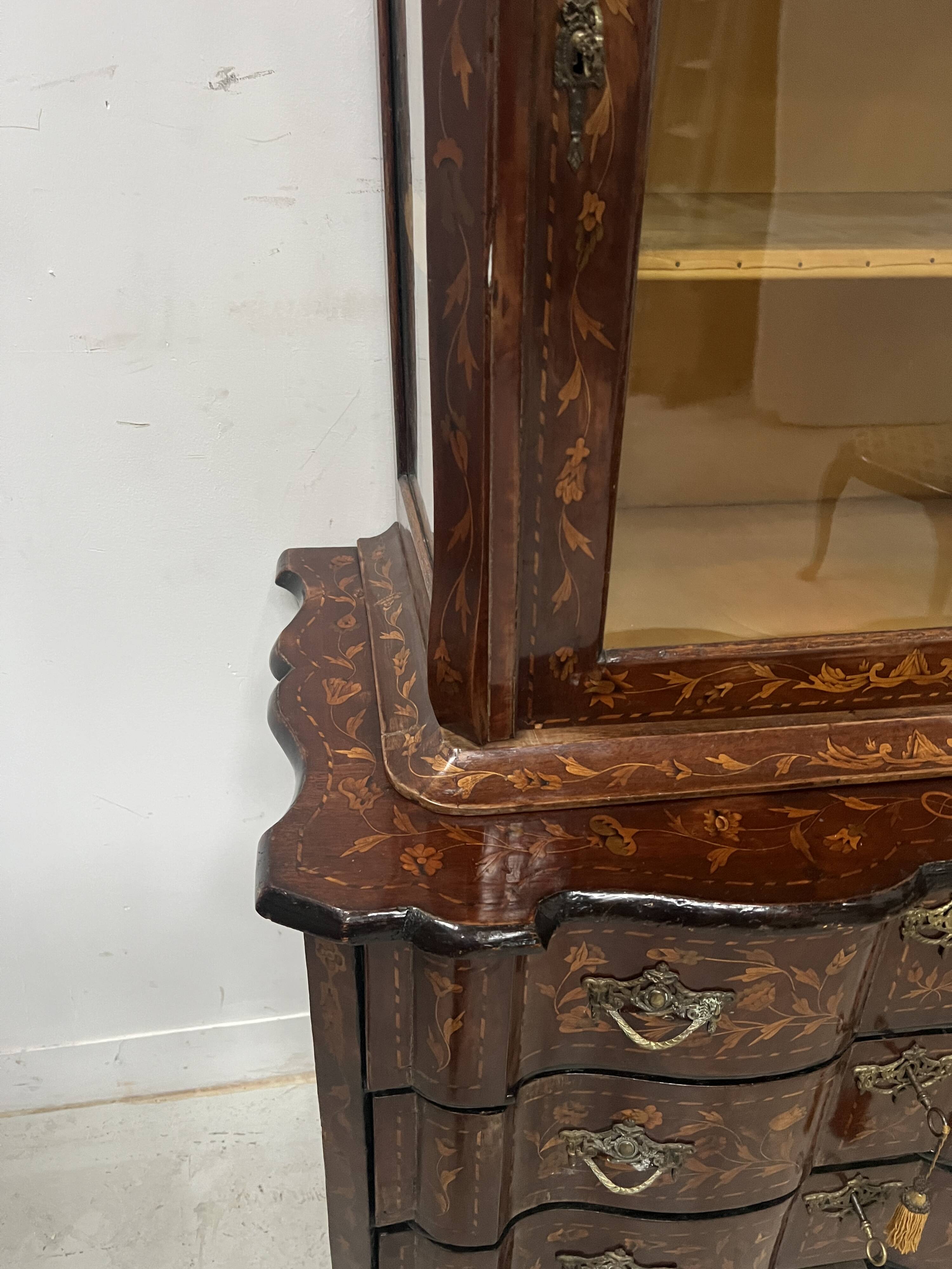 Dutch display cabinet in two parts made of marquetry wood.