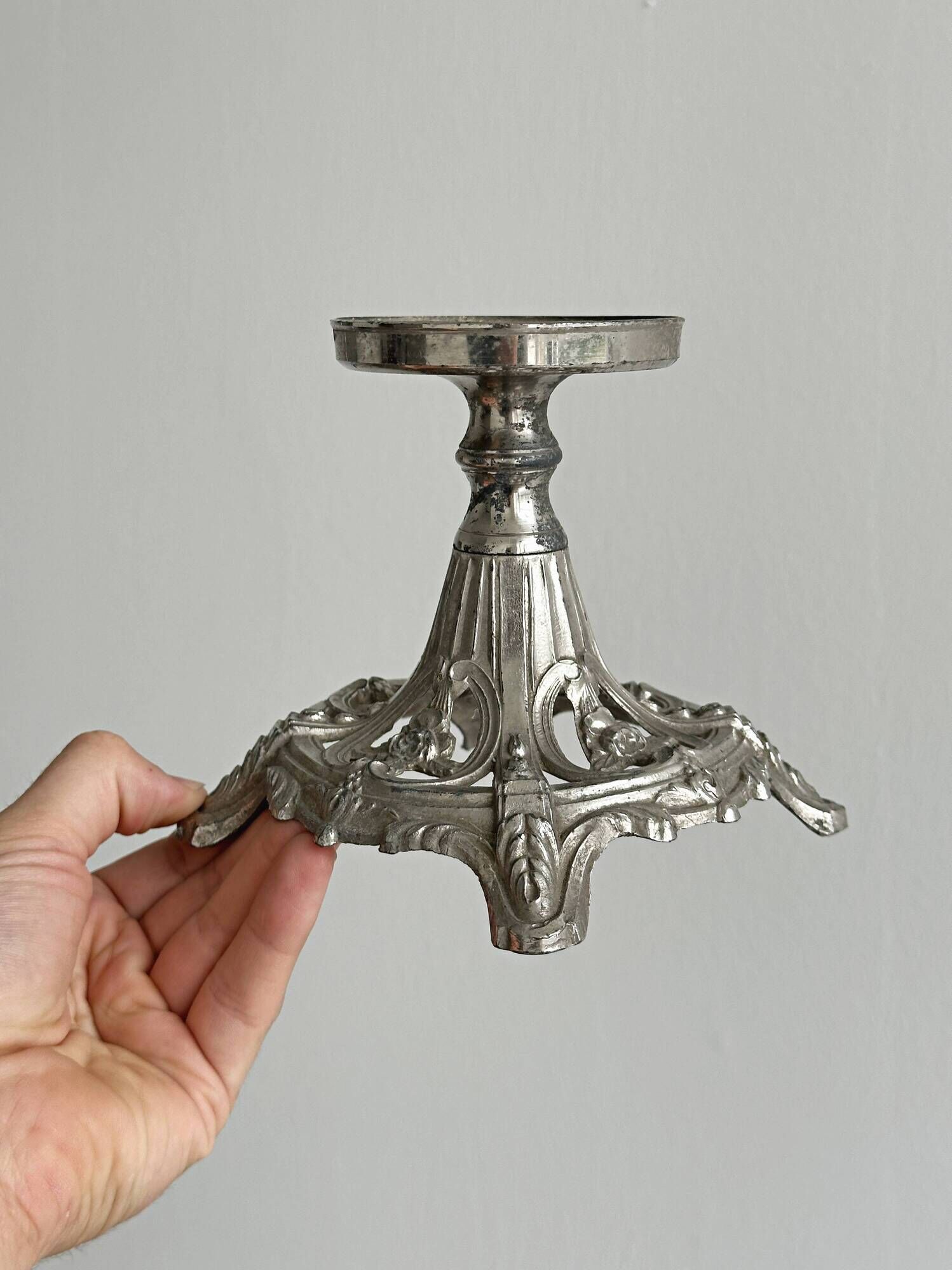 Candle holder with sculpted metal base, antique.