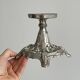 Candle holder with sculpted metal base, antique.