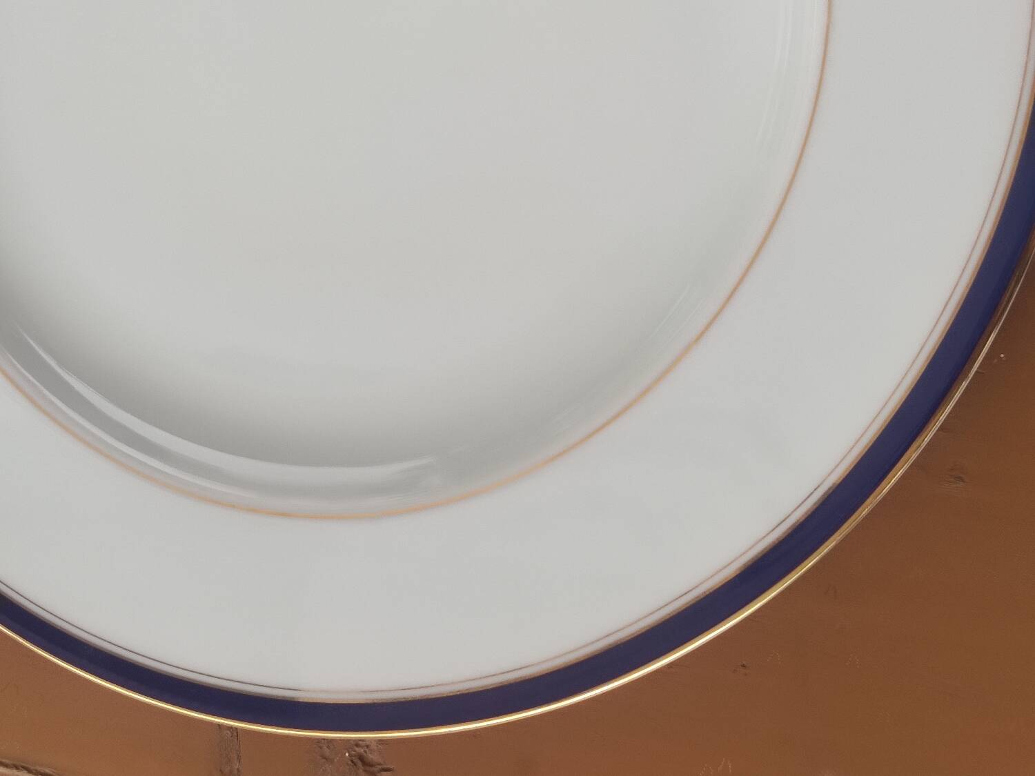 Six blue and gold Limoges porcelain dinner plates