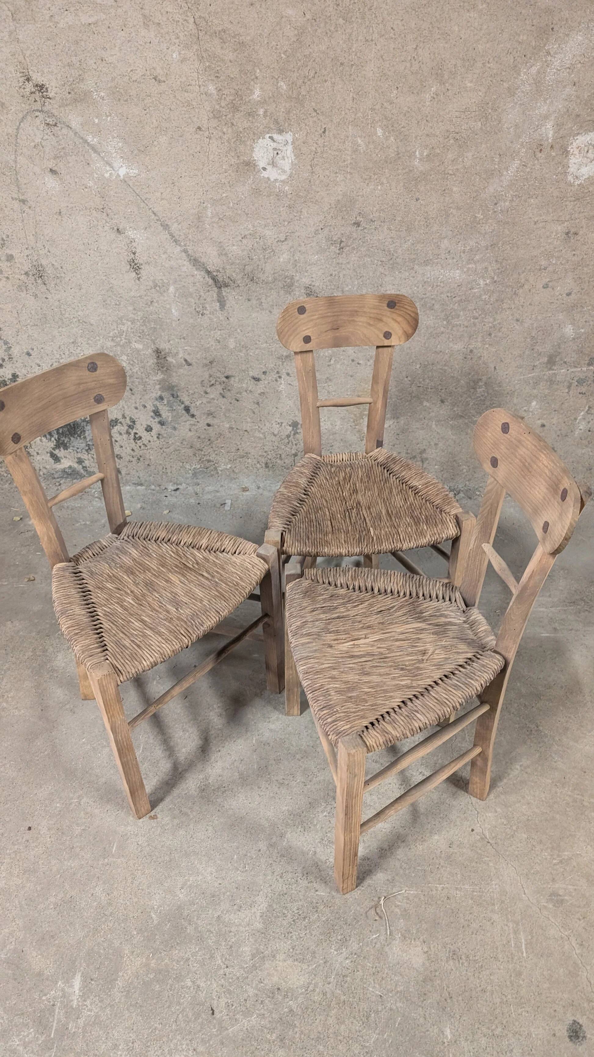 Set of 3 rustic wooden and woven straw chairs