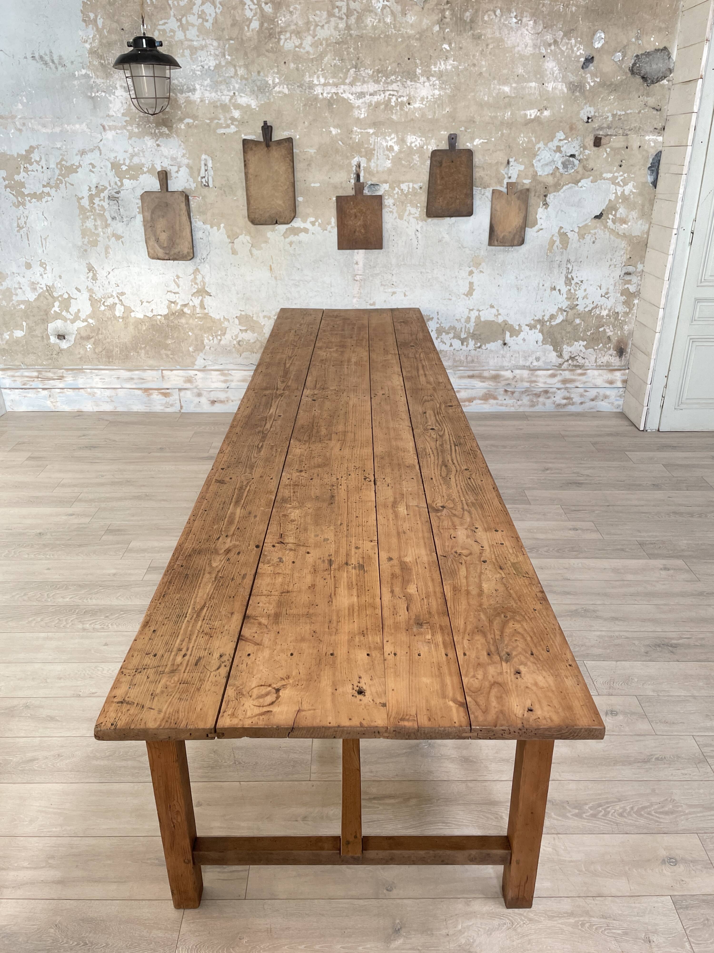 Solid wood workshop table with straight legs.