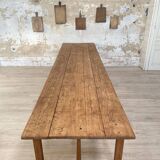 Solid wood workshop table with straight legs.