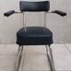 Vintage office chair in chrome metal and faux leather.