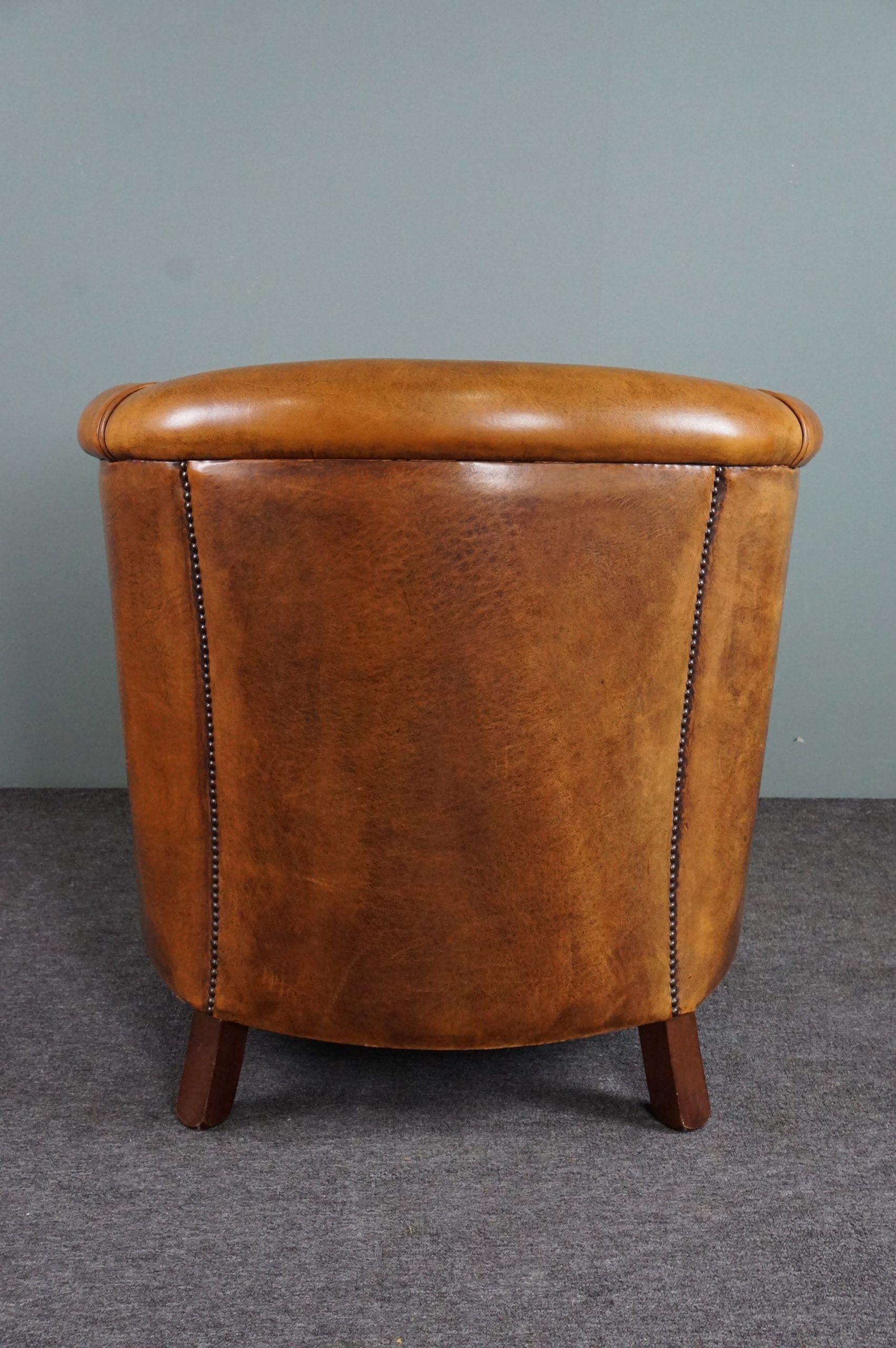 Club armchair in cognac-colored sheepskin