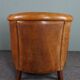 Club armchair in cognac-colored sheepskin