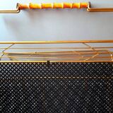 Perforated metal magazine rack, 1950