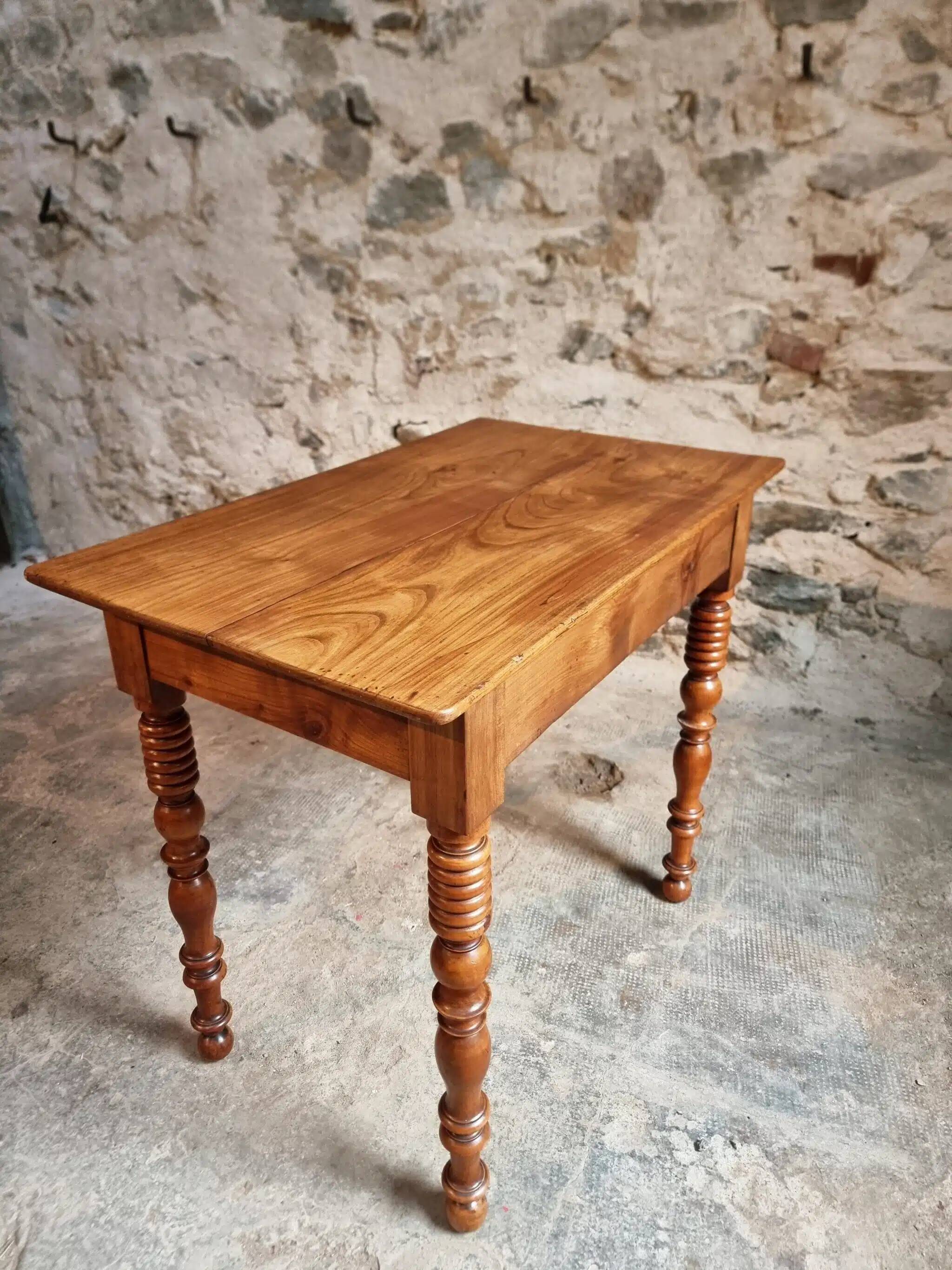 Small antique French writing table in walnut with a drawer, around 1900.