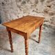 Small antique French writing table in walnut with a drawer, around 1900.