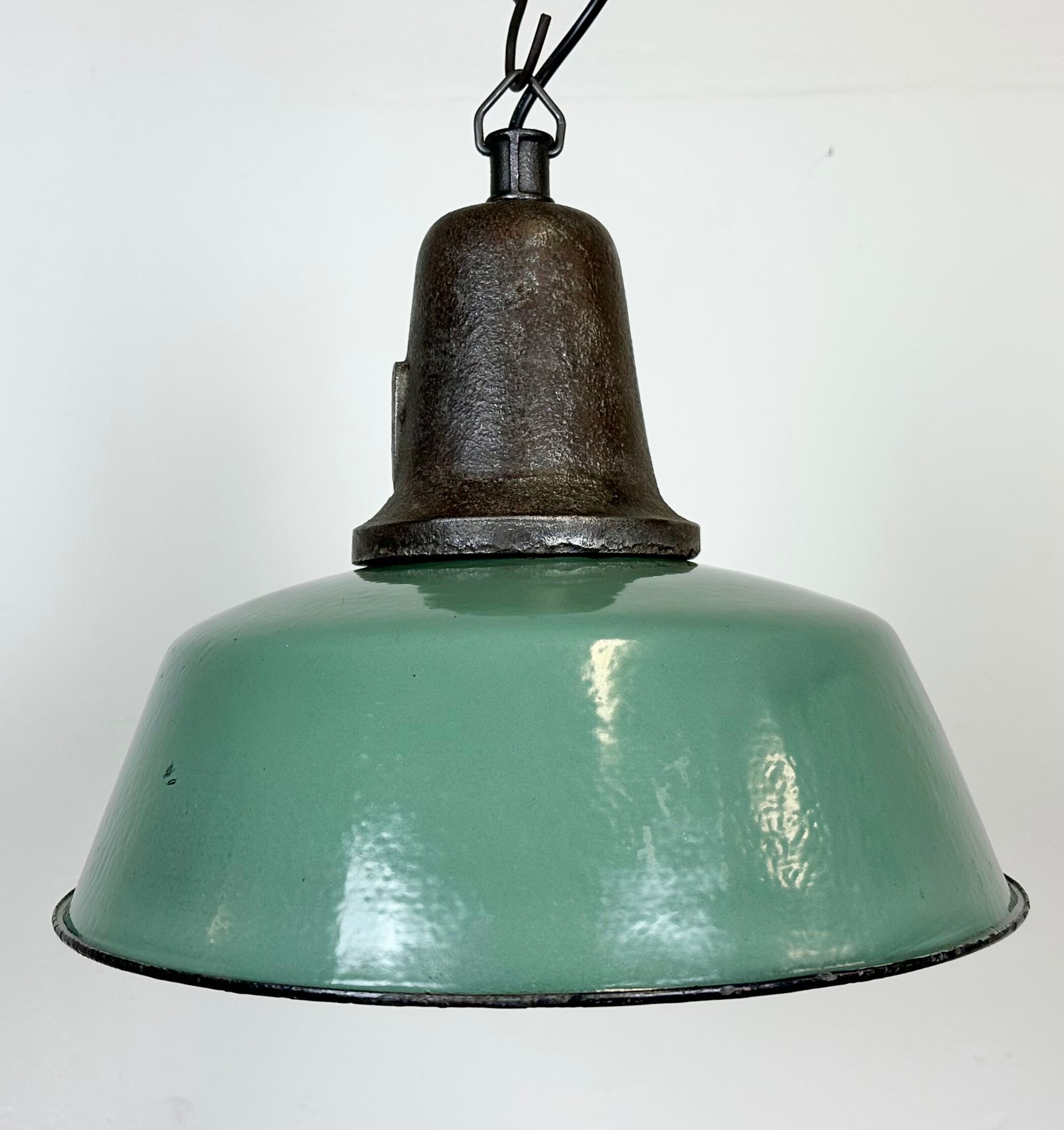 Industrial green enamel factory lamp with cast iron top, 1960s