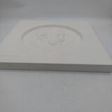 Portrait cast in low relief on plaster. SEDAP workshop.