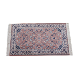 Saroukh design rug in fringed wool with a pink background 90x166cm