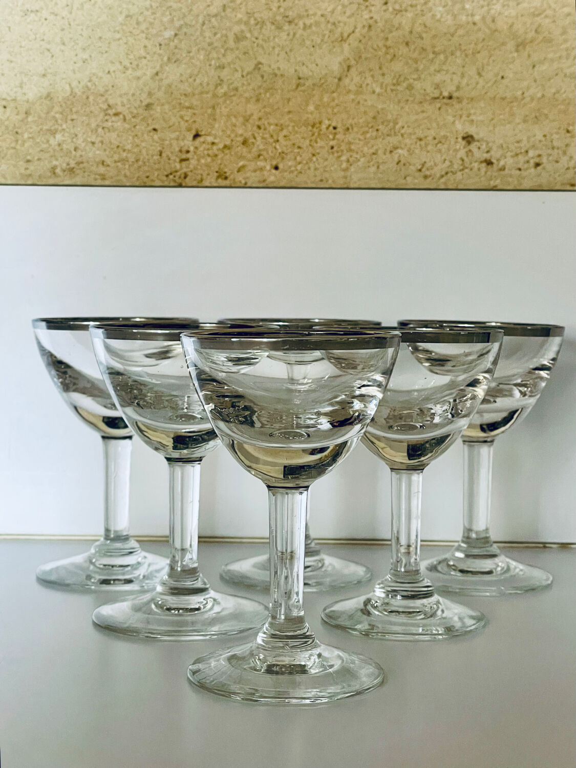 Set of 8 stemmed port glasses with silver trim.