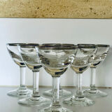 Set of 8 stemmed port glasses with silver trim.