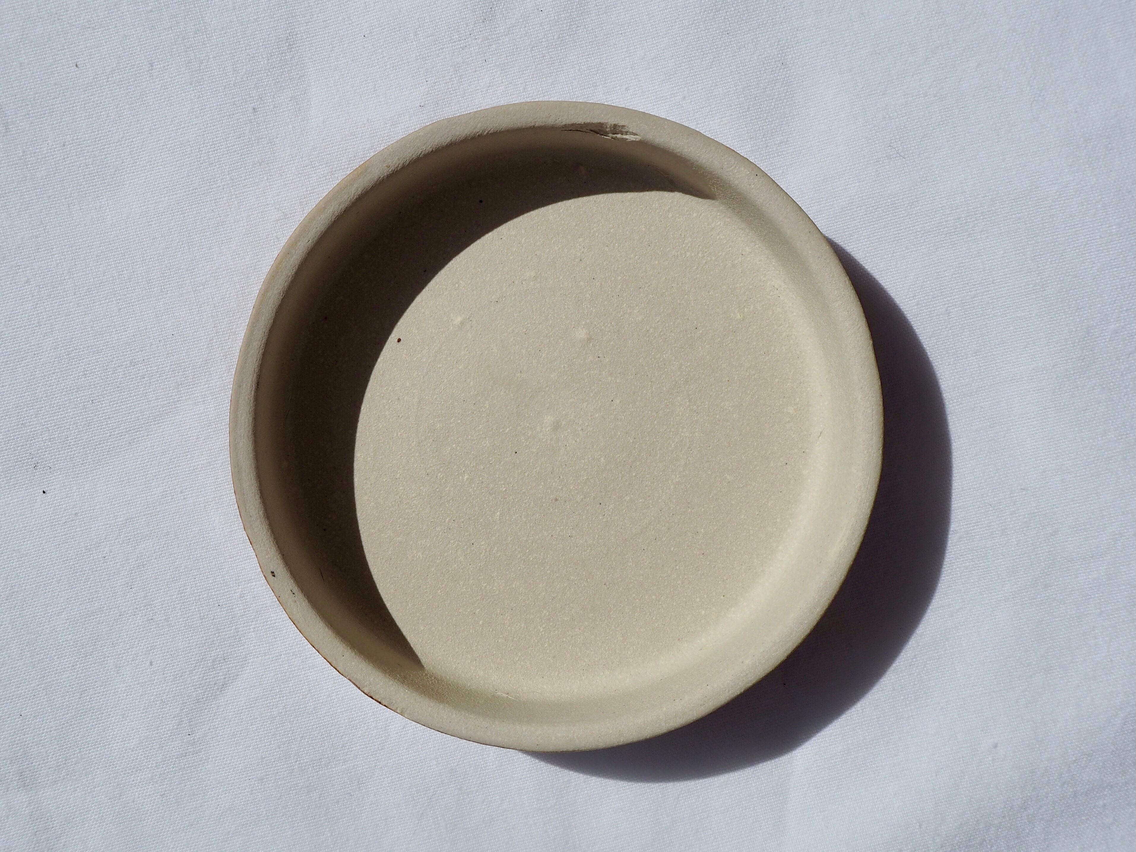 Trio of stoneware pots with lids