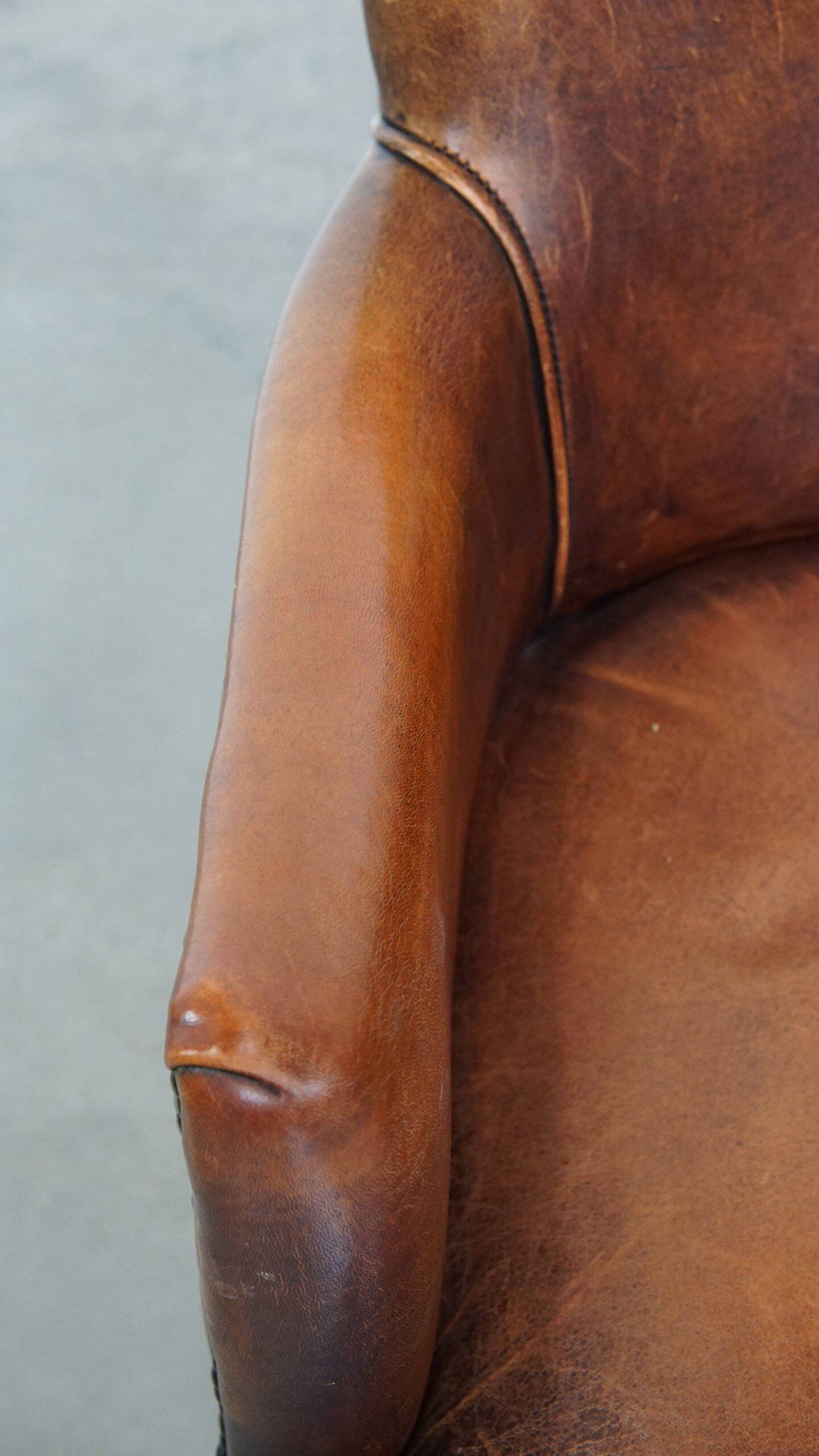 Amazing cognac-coloured sheepskin dining/side chair with armrests