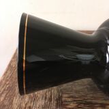Large black vase with faience gold edging