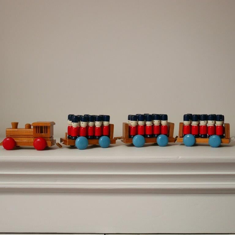 Wooden train with soldiers