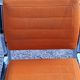Pair of designer armchairs in orange fabrics and chrome tubes from the 70s