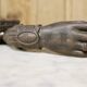 Antique cast iron door knocker in the shape of a 19th century hand