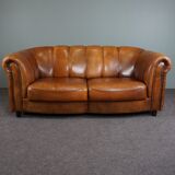 Sheepskin sofa with decorative nails