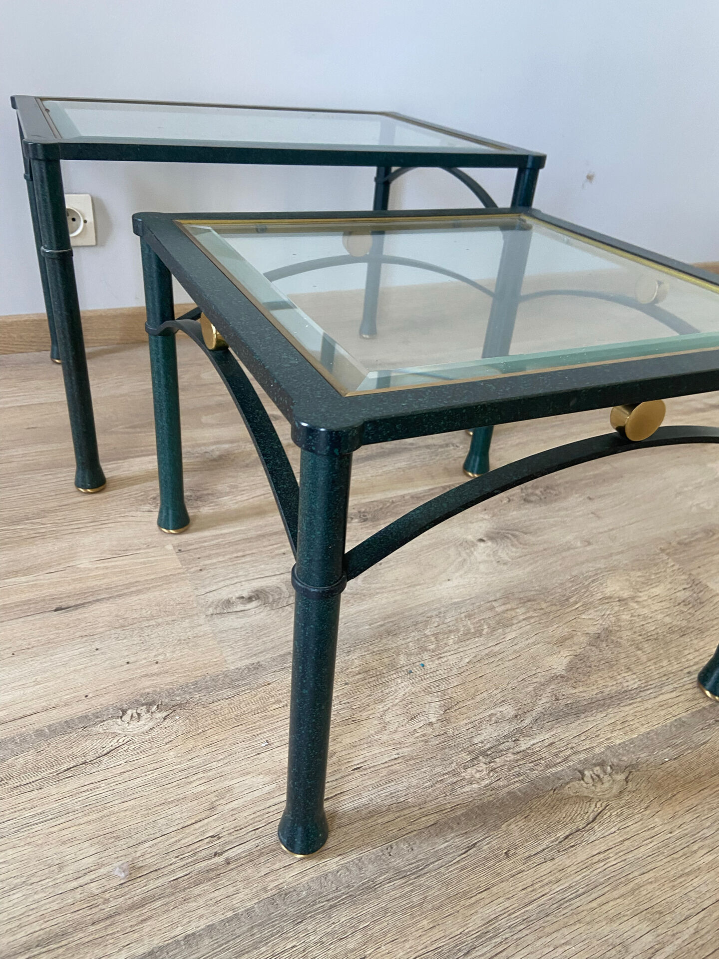 2 nesting tables from the 1960s in metal and bevelled glass.
