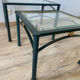 2 nesting tables from the 1960s in metal and bevelled glass.