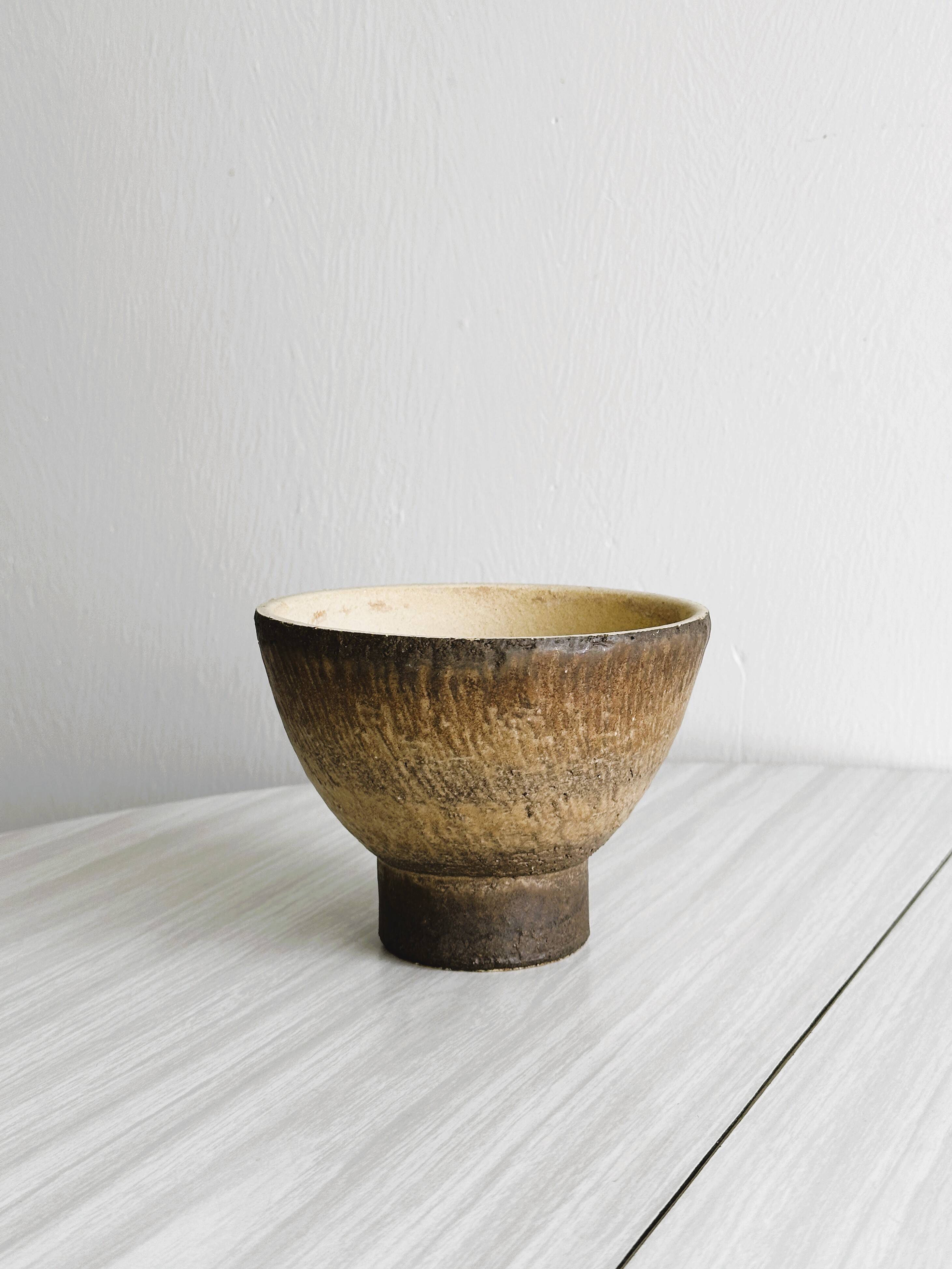 Small vintage cup in rustic glazed stoneware