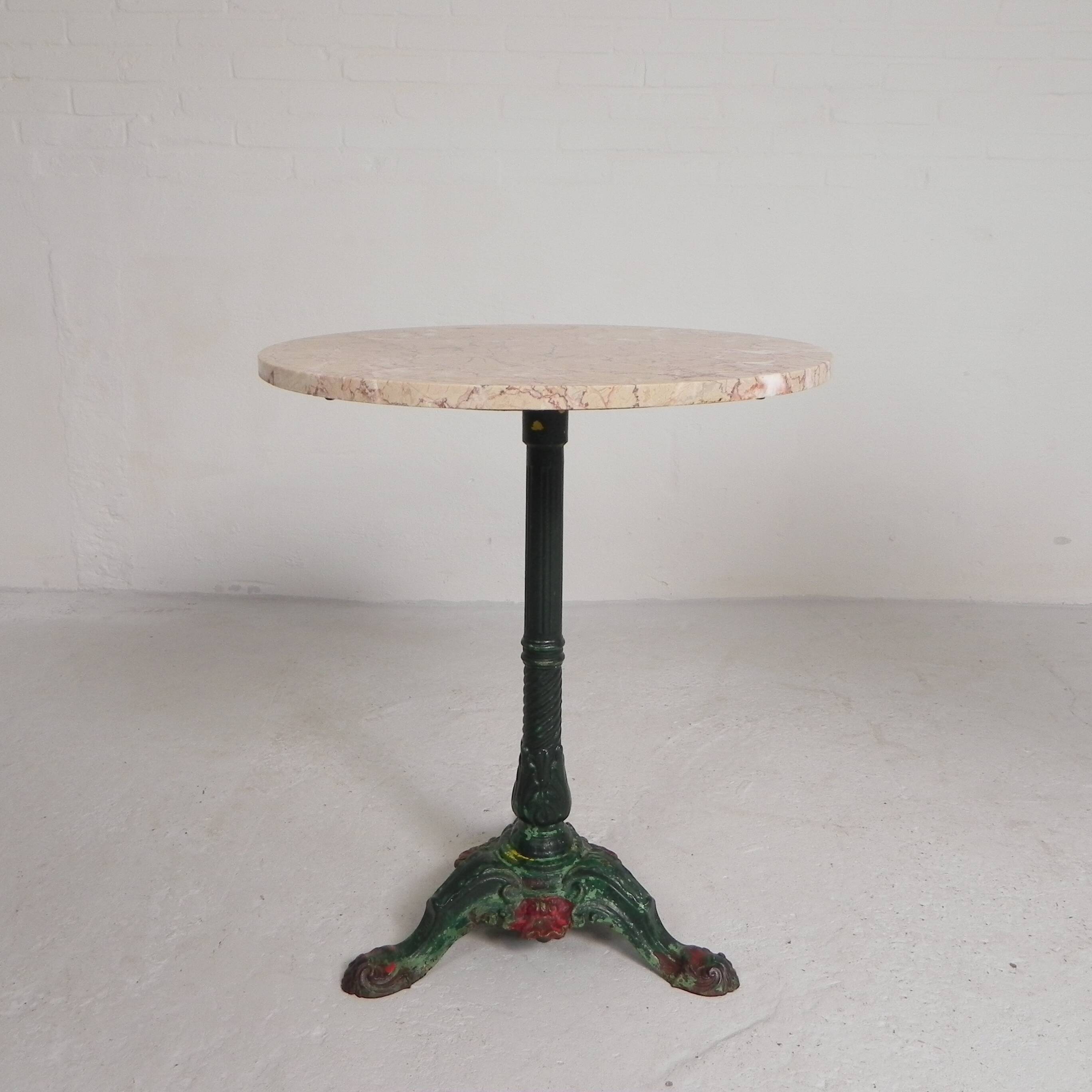 Bistro table with cast iron legs and marble top, 1920s.