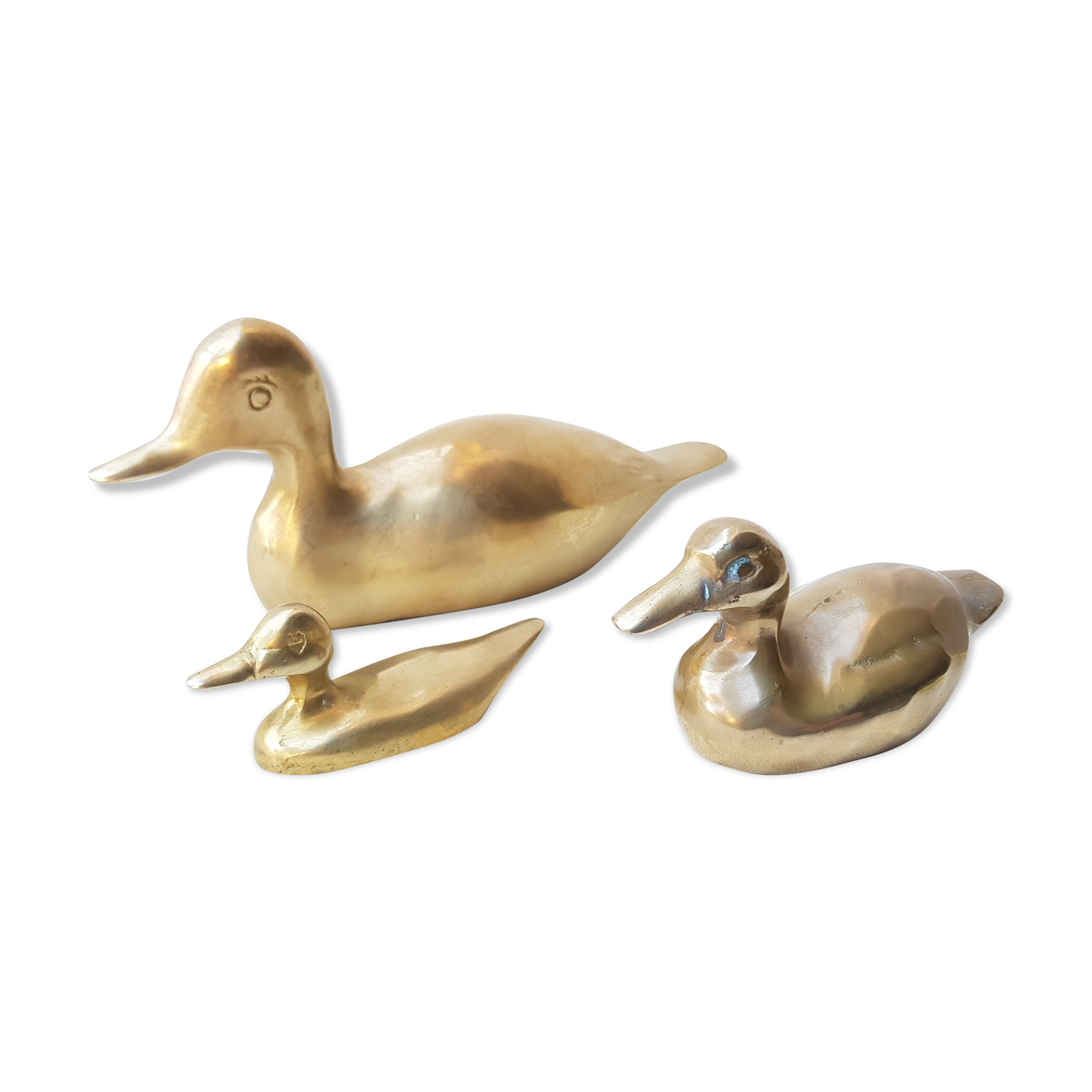 Trio of brass ducks
