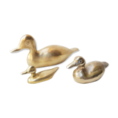 Trio of brass ducks