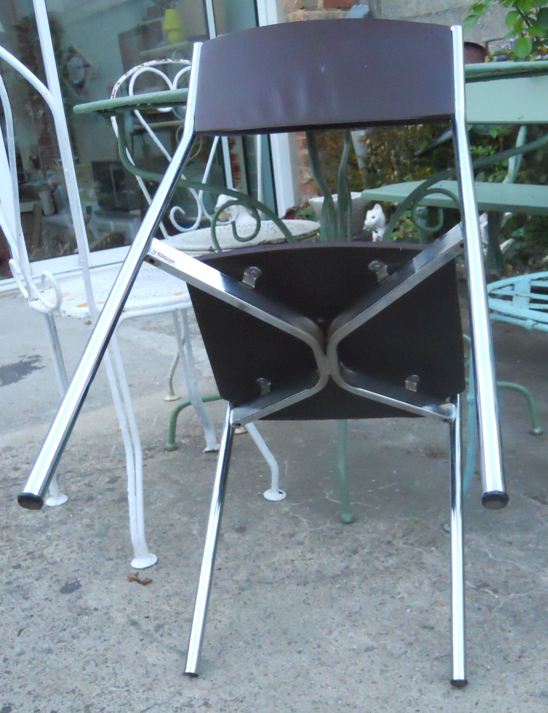 Vintage chrome metal chair and faux black leather
