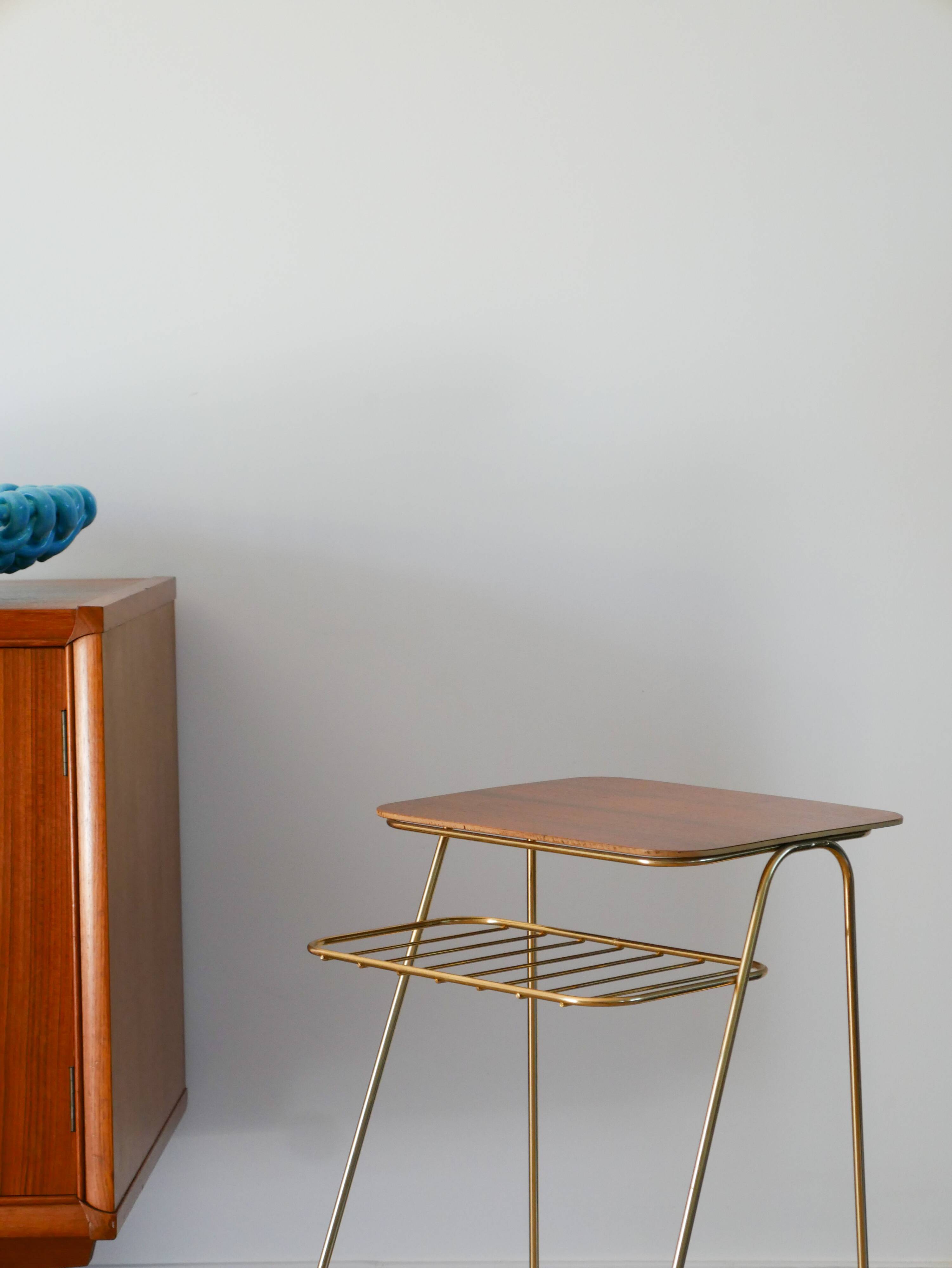 Small brass side table with a teak top, 1960.