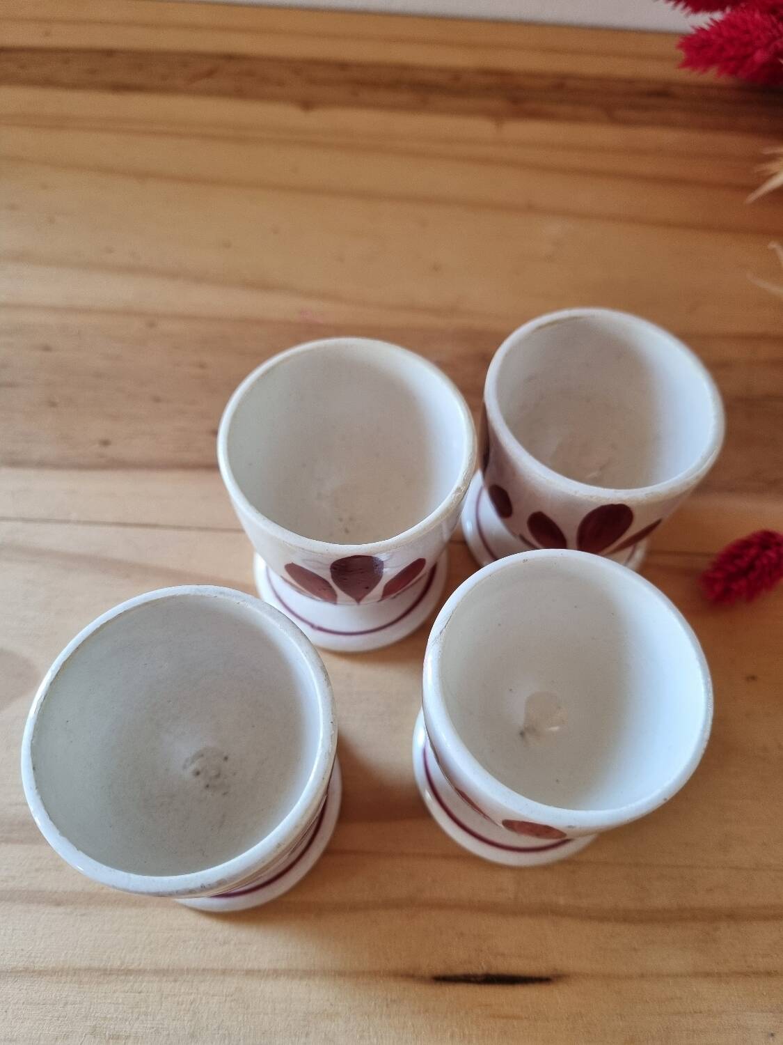 Set of four Digoin-style egg cups