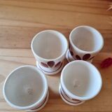 Set of four Digoin-style egg cups
