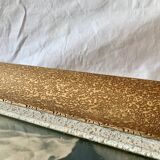 Old wall frame in carved gilded wood