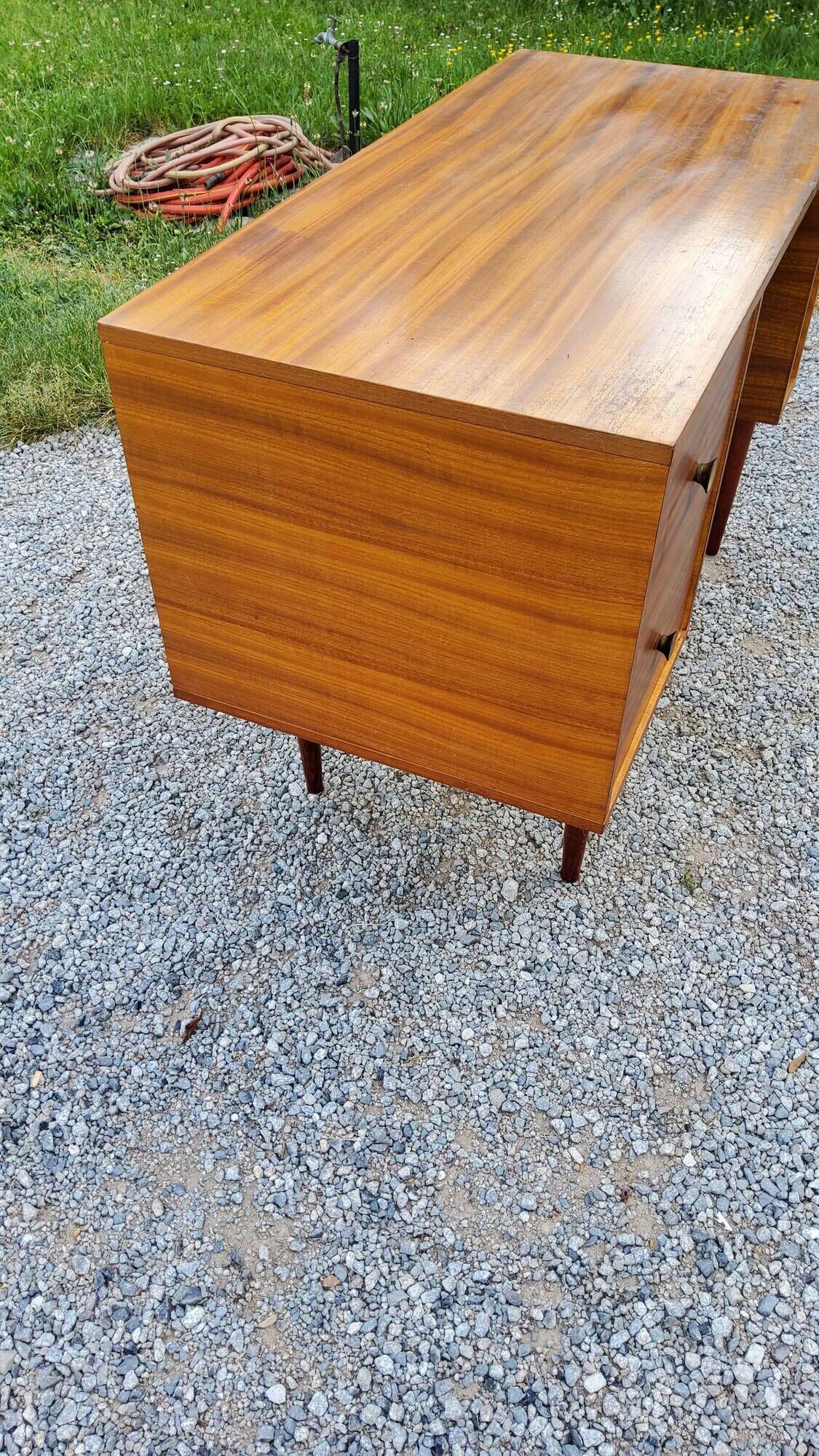 60s desk in golden blond mahogany with conical coffered feet