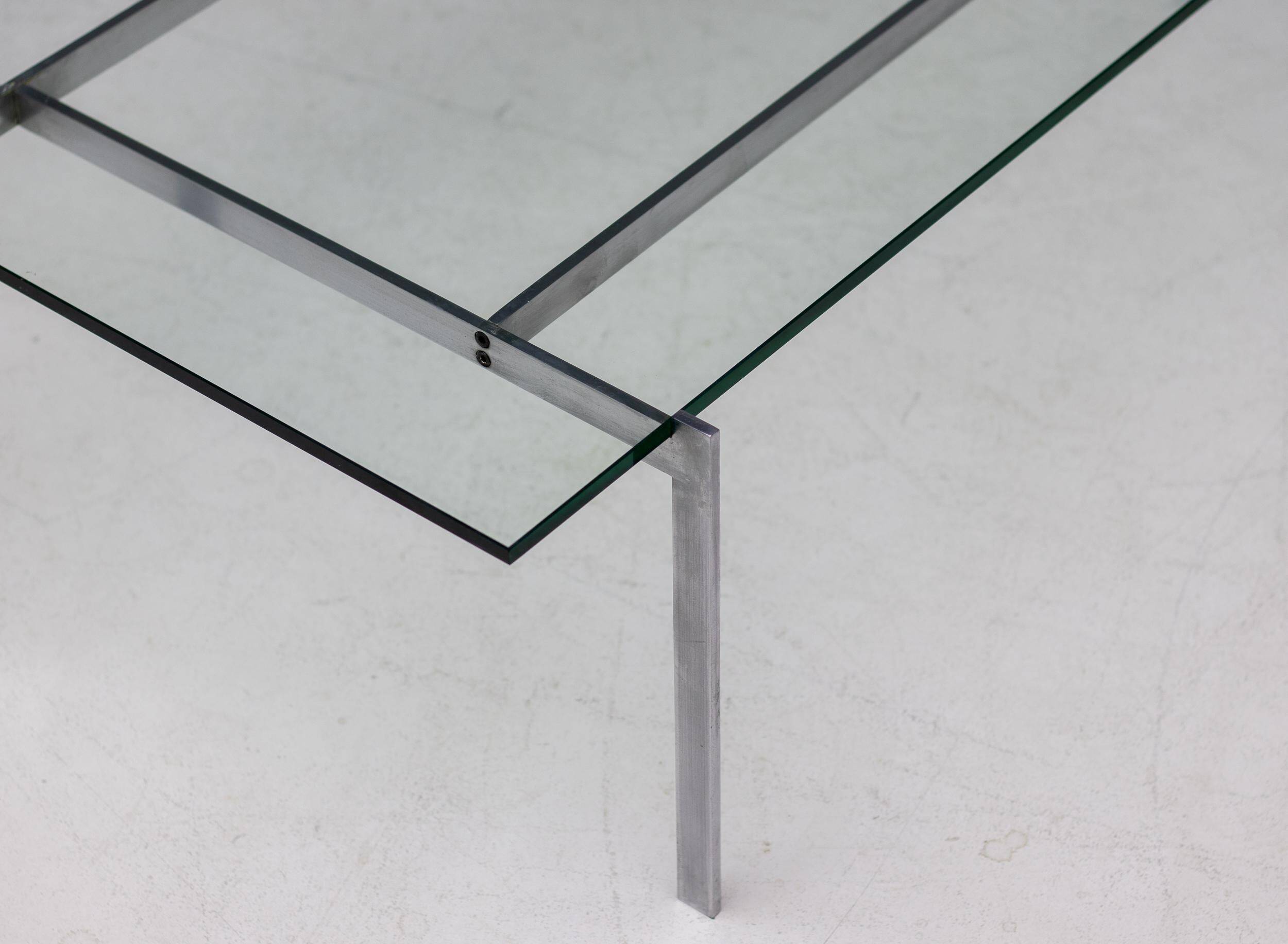 Architectural rectangular coffee table in steel and glass.