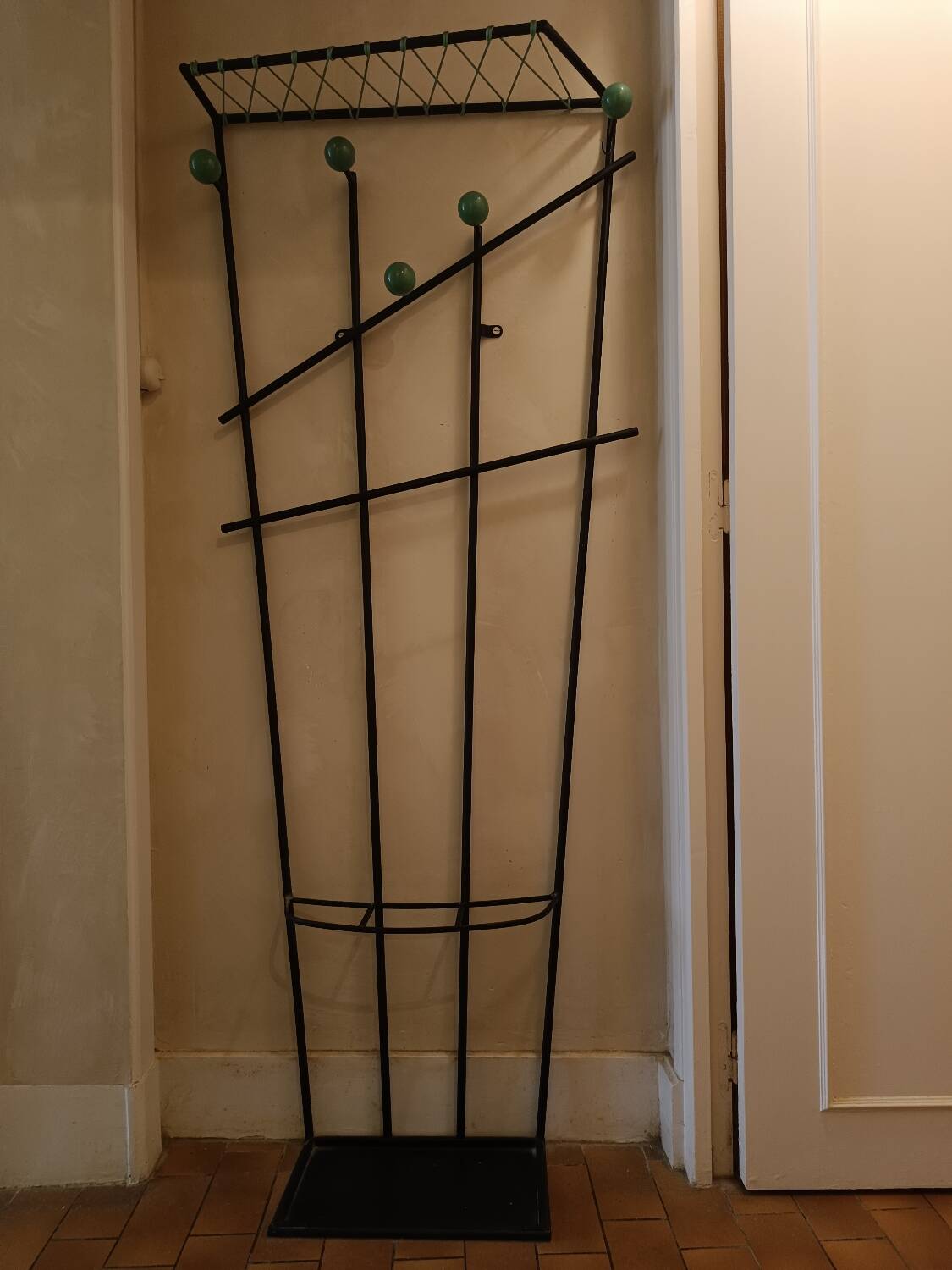 Wall-mounted metal coat rack