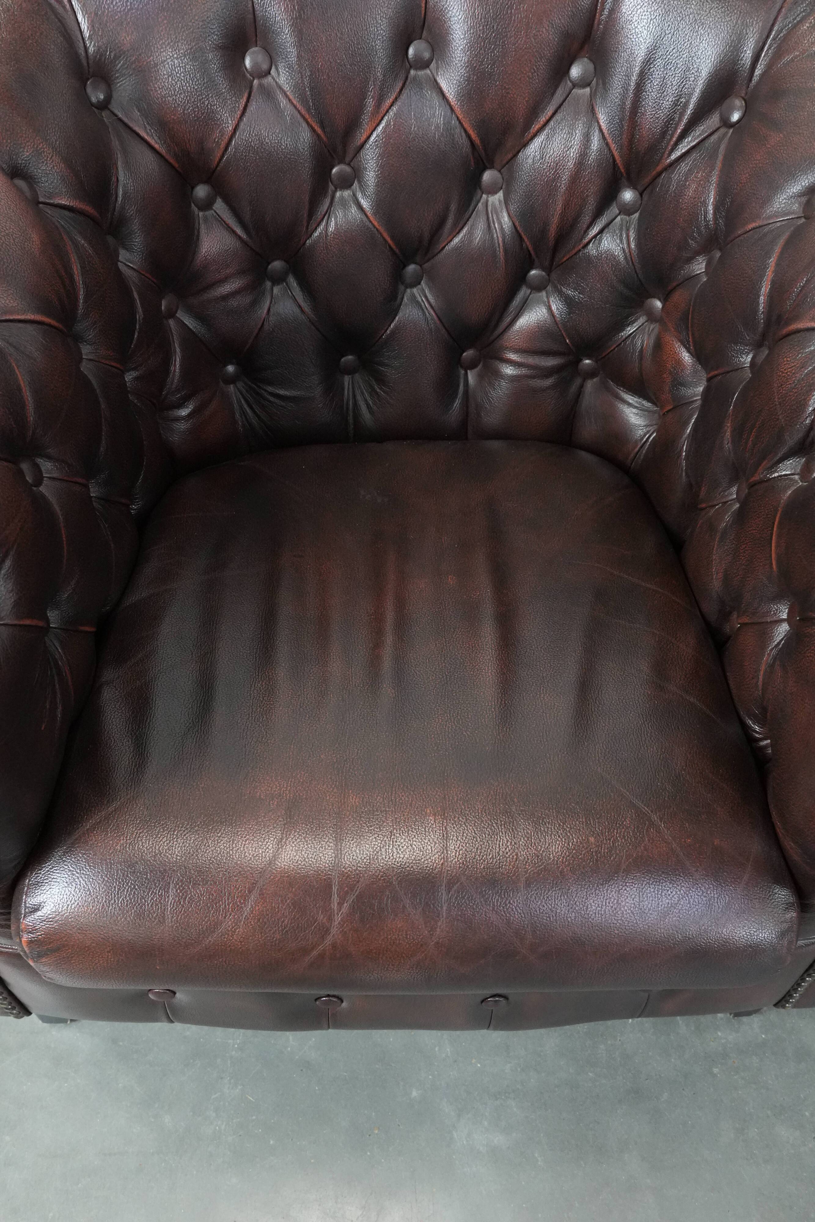 Set of three classic English-style Chesterfield cowhide  club armchairs