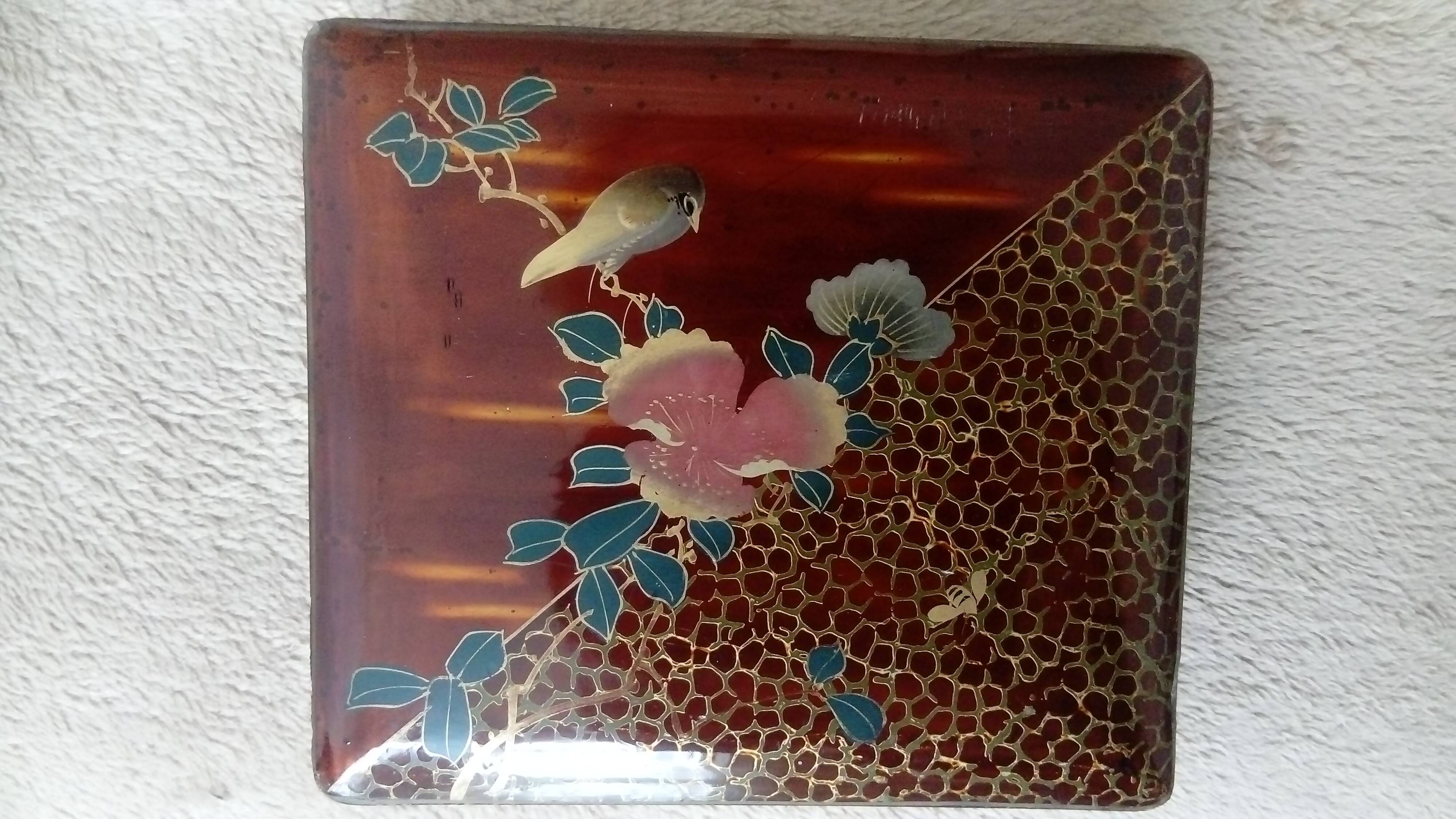 Old lacquered jewelry box with Asian decoration bird, flower, bee