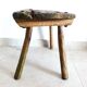 Old milking stool, old farm stool, primitive art.