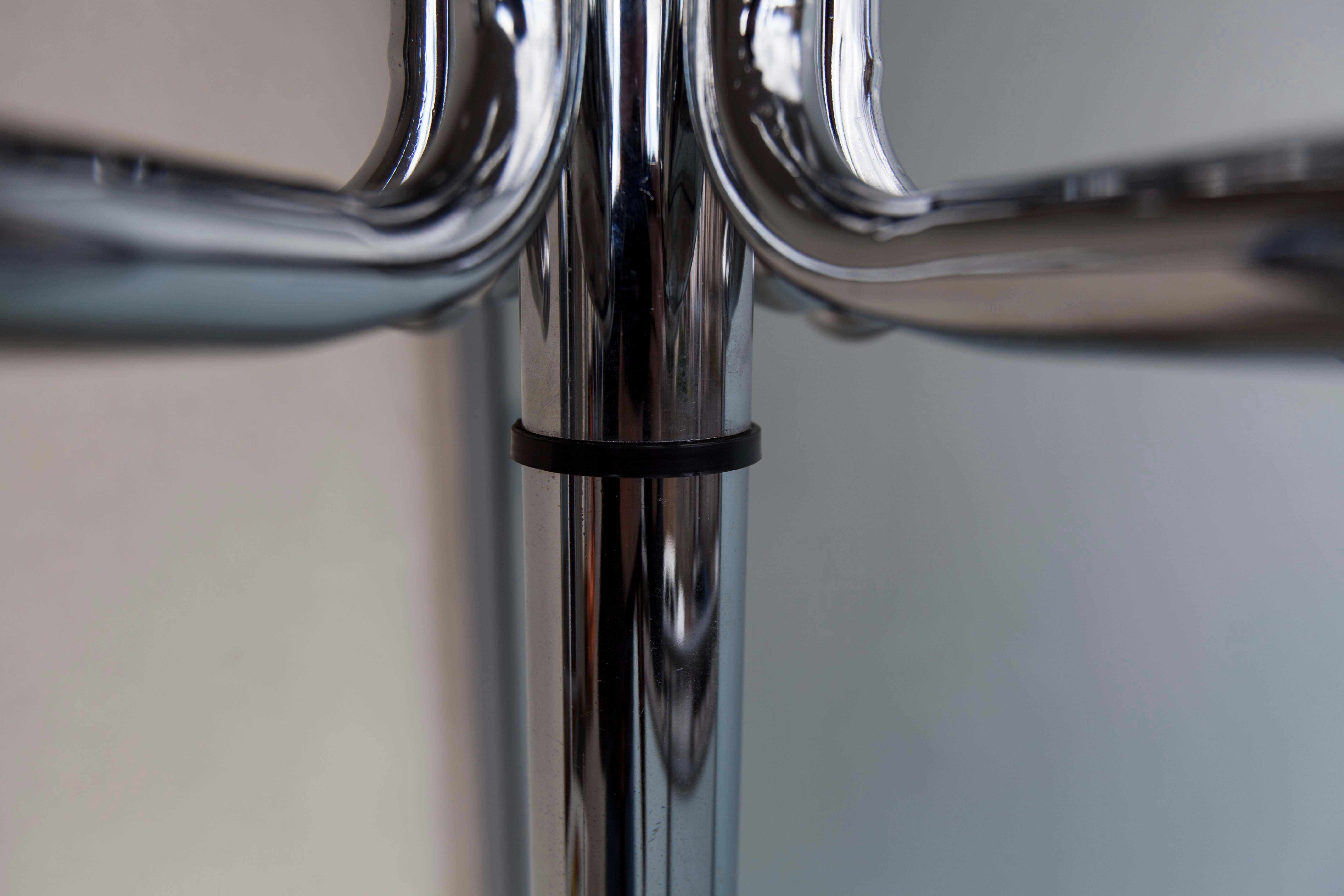 Chrome metal parrot coat holder from the 70s