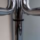Chrome metal parrot coat holder from the 70s