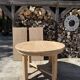 Round solid oak table with extensions, maximum 220cm.